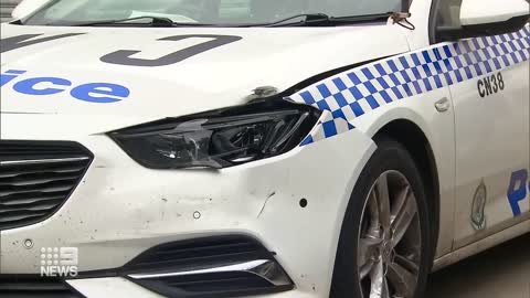 Alleged white supremacist charged with ramming into police car | 9 News Australia