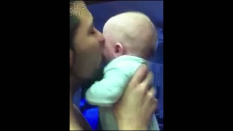 Baby doesn't like daddy's kiss