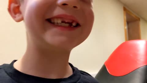 Boy shoots out his loose tooth with a Nerf blaster