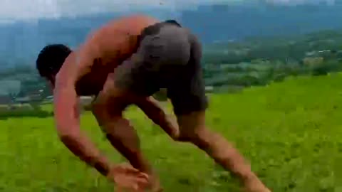 A man runs across the field like an animal