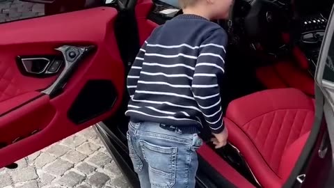 Kid sees his dream car - seee the happiness on his face - cute kids video