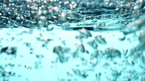 Blue Scene Of Water Splashing From Left To Right, Generating Waves And Bubbles In 4K