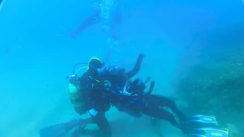 Incredible footage of scuba divers' underwater rescue mission in the deep ocean