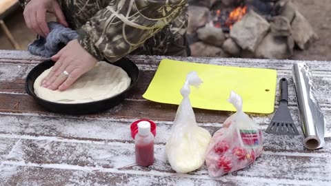 Cooking pizza in the middle of rocks