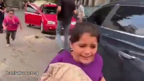 Palestinian children are screaming and running away after hearing bombing sounds nearby them