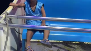 Child Just Chills on Amusement Park Ride