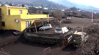 Military clean up ash from La Palma volcano