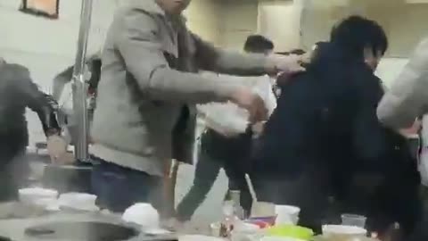 Person Keeps Eating During Restaurant Brawl