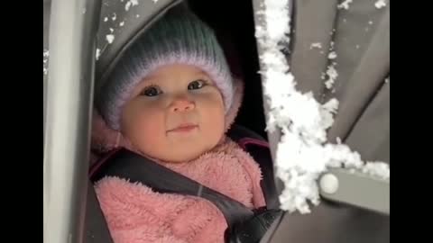 little girl playing in the snow