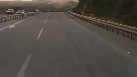 *FOOTAGE REVEALS ROCKETS STRIKING NEAR MOTORISTS