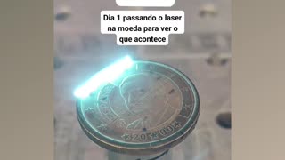 Ancient coin from Spain being cleaned with laser