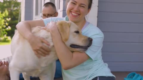 Woman Hugging a Dog