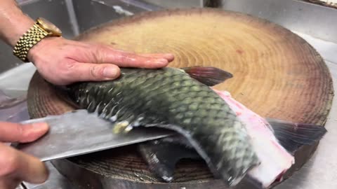 Dinner for the two brothers and their parents-in-law, a raw green bamboo fish