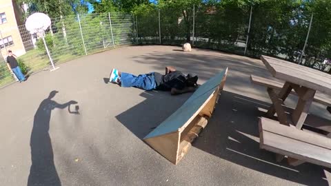 Skateboarder Slips Attempting a Noseslide on a Picnic Table
