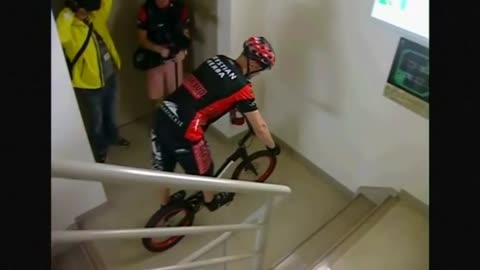 Cyclist hops up Taipei 101 Tower, beats his own world record