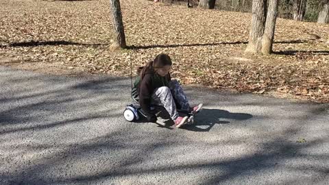 Lily Tries riding a hoverboard for the first time