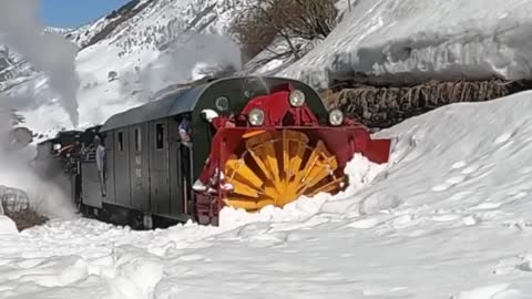 100 years Old train clears snow from Track