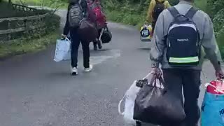 Economic Migrants are seen leaving the property of Magowna House Hotel...