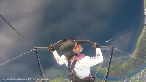 Champion hang-glider’s helmet cam captures the terrifying moment his craft...