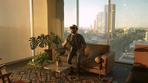 Man wearing augmented reality glasses in an apartment