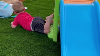 Child Doesn't Quite Make It to the Slide