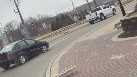 Car slams through sign