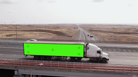 Large truck driving along a rural highway