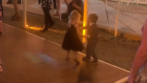 Heart melting little boy and girl dance at a wedding