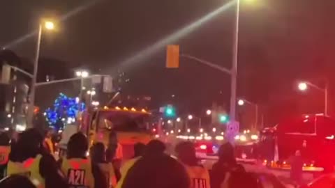 The police in Ottawa try to blockade but the people push them back