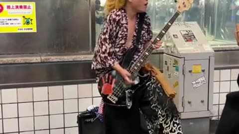 Subway guitar surfer