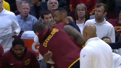 KEVIN LOVE PUTS LEBRON JAMES IN A HEADLOCK AFTER HE DUNKS ON HIM