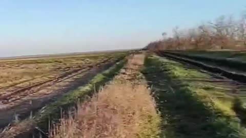 A Russian cruise missile passes over V.S.U. soldiers in the Zaporozhye region.