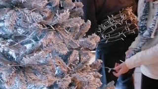 Elderly Couple has Ingenious Way of Lighting Christmas Tree