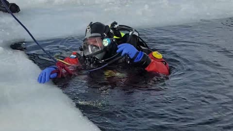 Fort McCoy DES Fire Department dive team holds ice rescue training at frozen lake at Fort McCoy