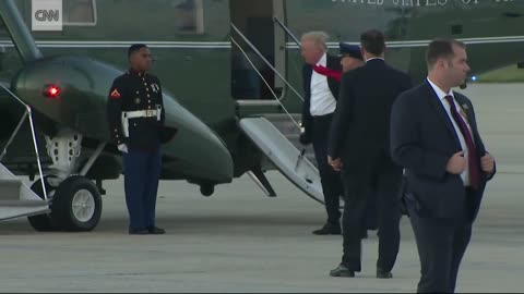 Trump stops to retrieve Marine's hat