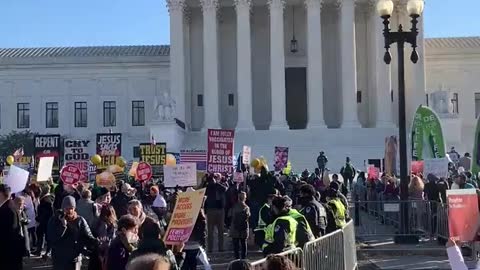 Pro-life and pro-choice protestor groups outside the Supreme Court