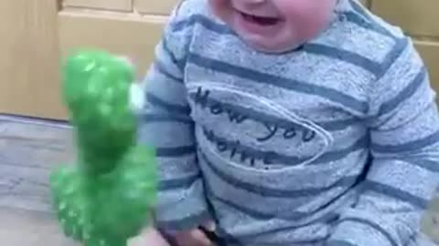 Babies funny reaction while playing with dancing cactus😂