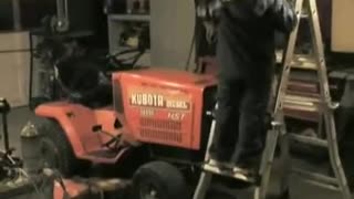 MM #3 - 2009 Daniel lowering the Kubota back on to the mower deck.