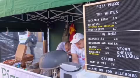 Buying a fresh hand stretched pizza : Italian street food by "pizza pierco "