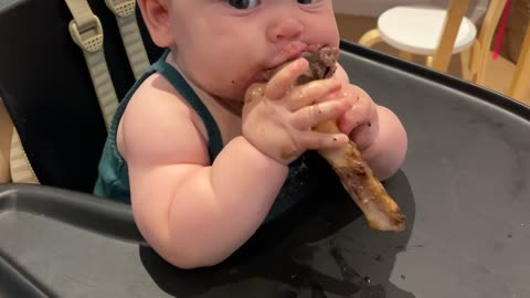Baby Enjoys a Lamb Chop