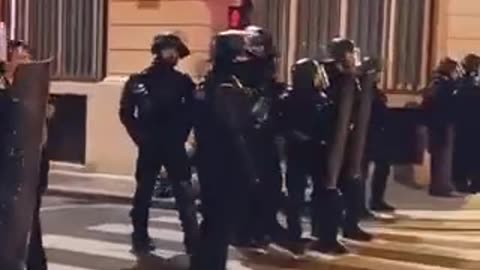 Some police officers in France remove their helmets and stop fighting with protesters.