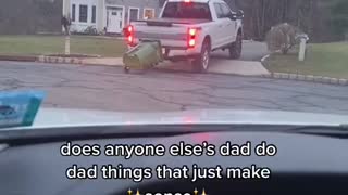Dad Pulls Garbage Back to House on Truck Hitch