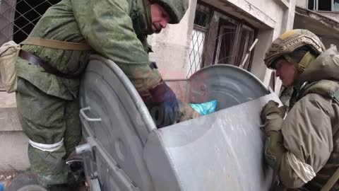 Ukraine War - Neo-Nazis from Azov threw the corpse of their colleague into a trash can (Graphic)