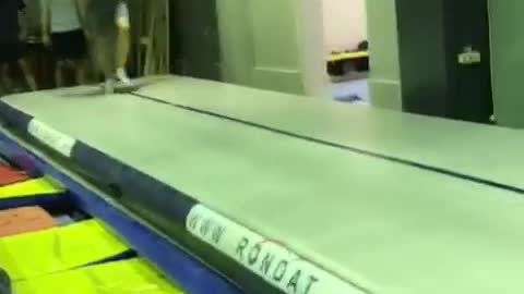 Guy does gymnastics tumbling and lands on stomach