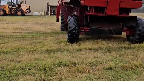 Moving the combine out of the rain while working on it