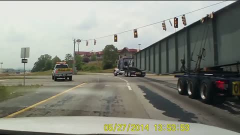 Truck Carrying Support Beam Tips Over on Highway