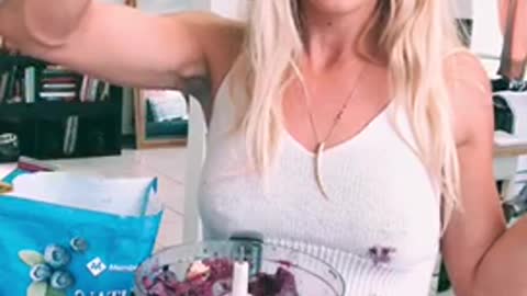 Blonde girl tries to put spoon into blender to mix smoothie busts open cap