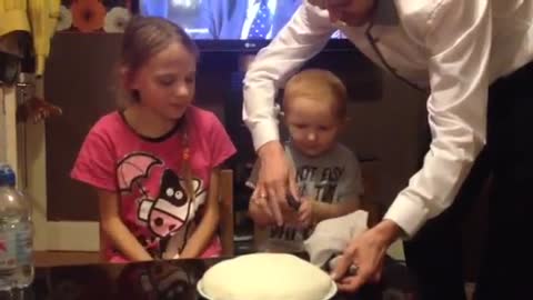Toddler confused by gender reveal cake
