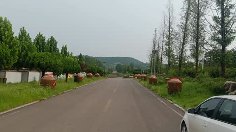 There are various jars on both sides of the road