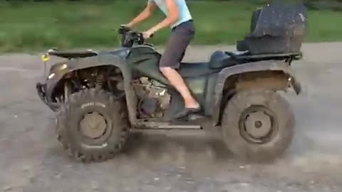 Slowmo. ATV take donuts on the sunset.